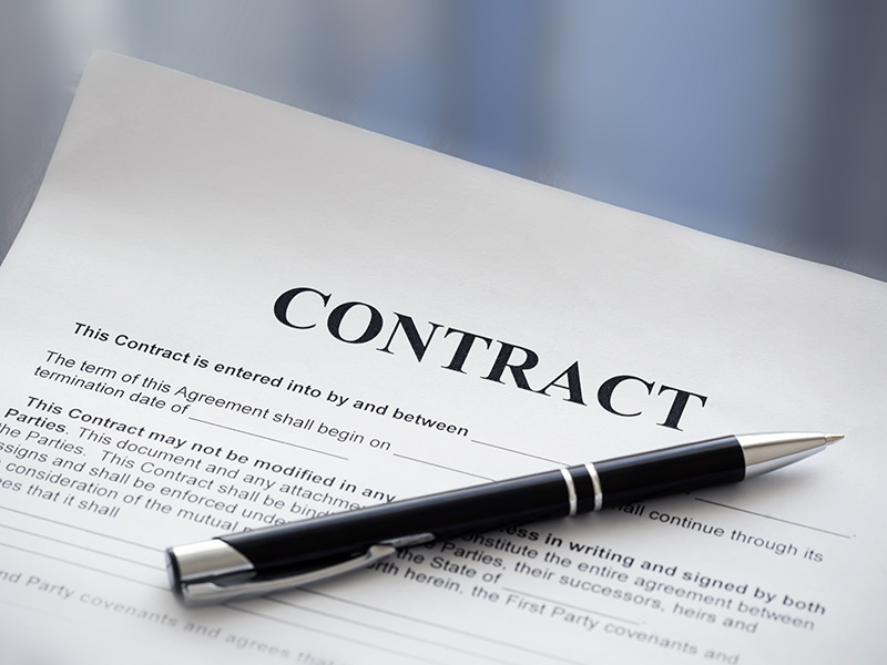 Contract with pen. Looking for a small business lawyer in San Antonio? Susan Simmons Law can help.